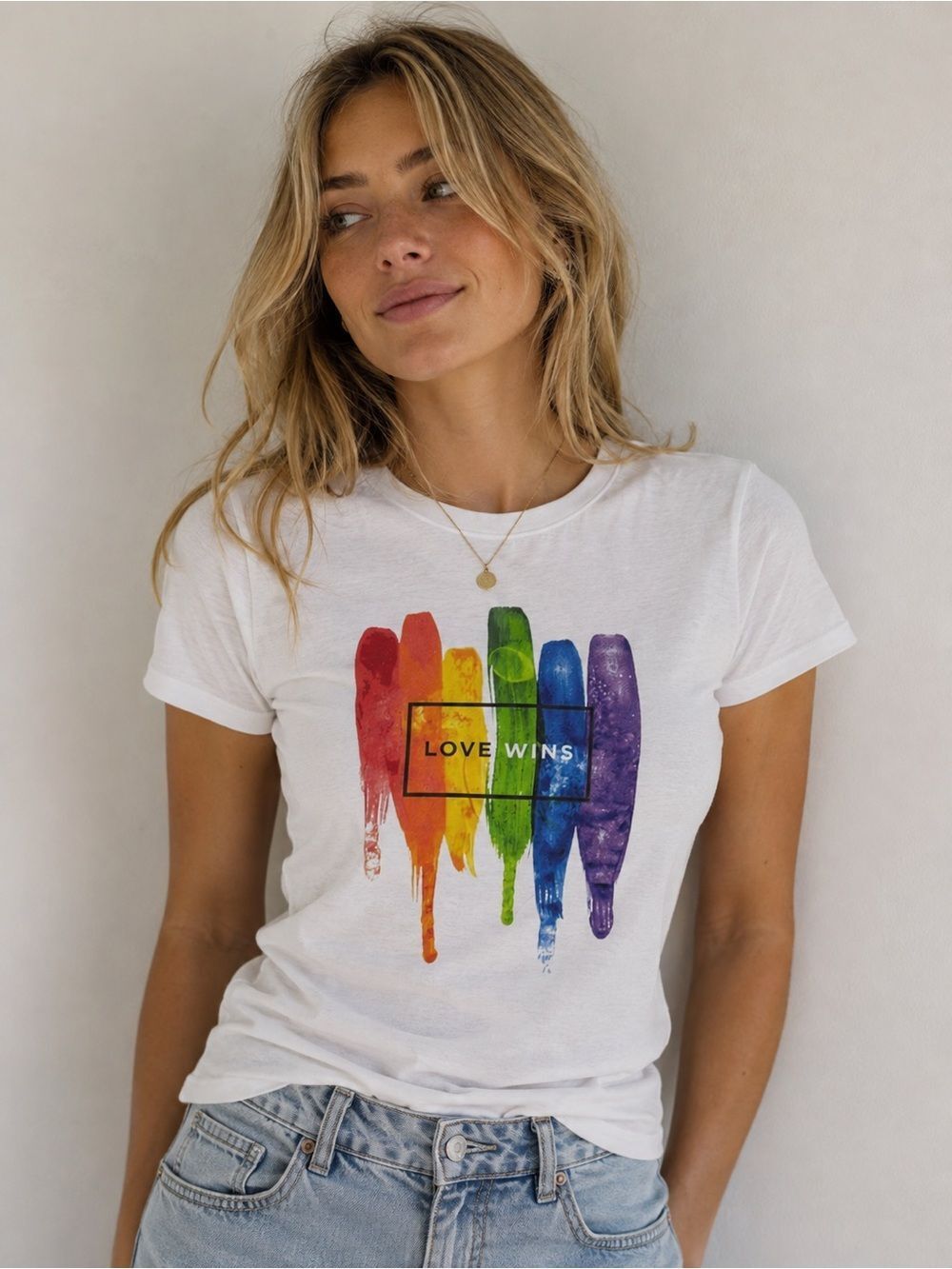 Love Wins T-shirt - rainbow paint themed design that says “love wins”